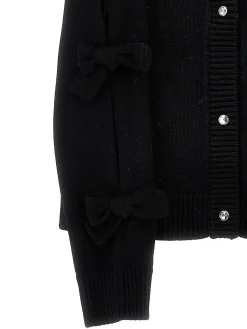Cardigan con fiocchi applicati
