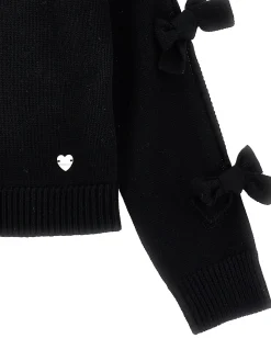 Cardigan con fiocchi applicati