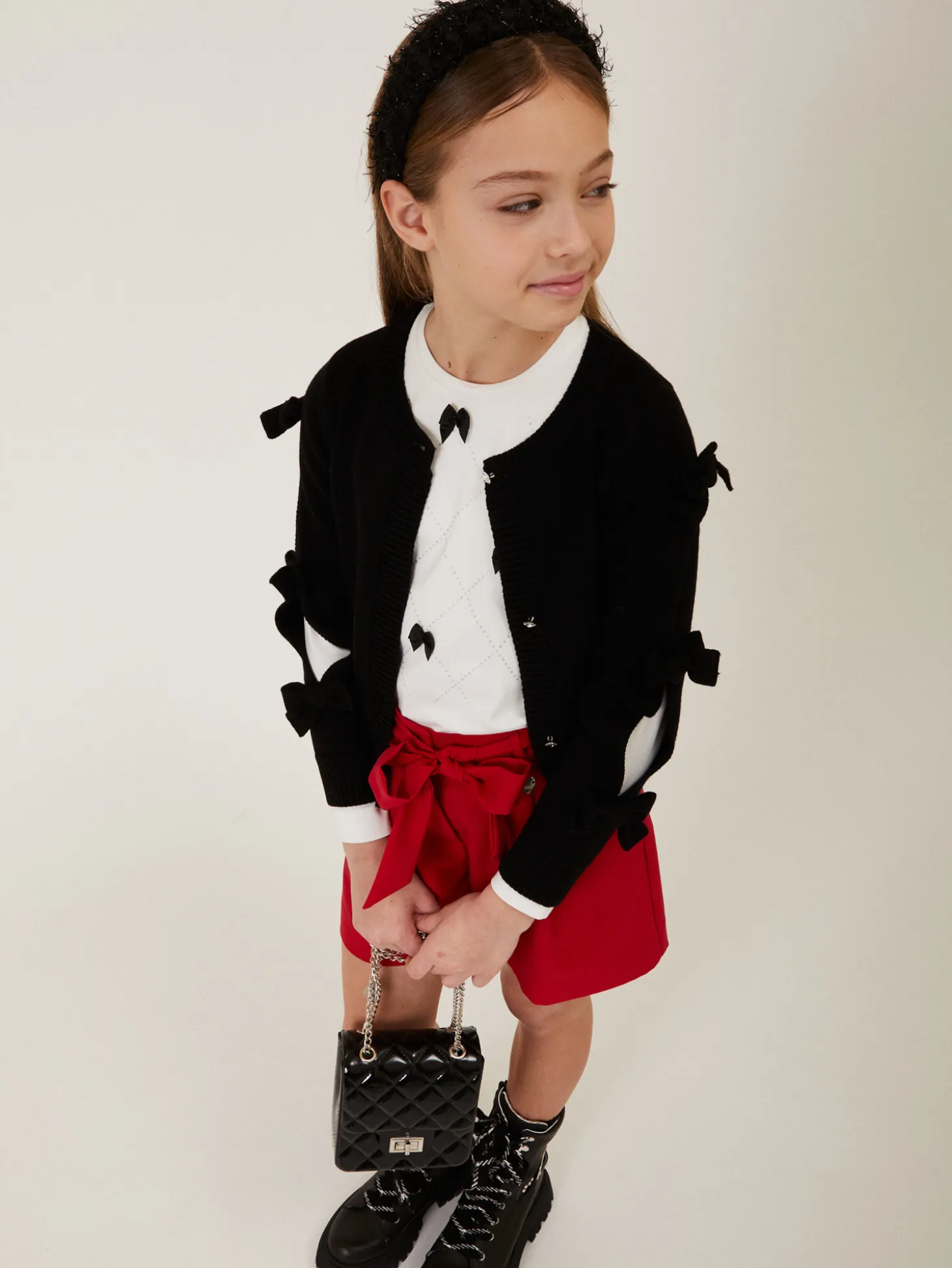 Cardigan con fiocchi applicati