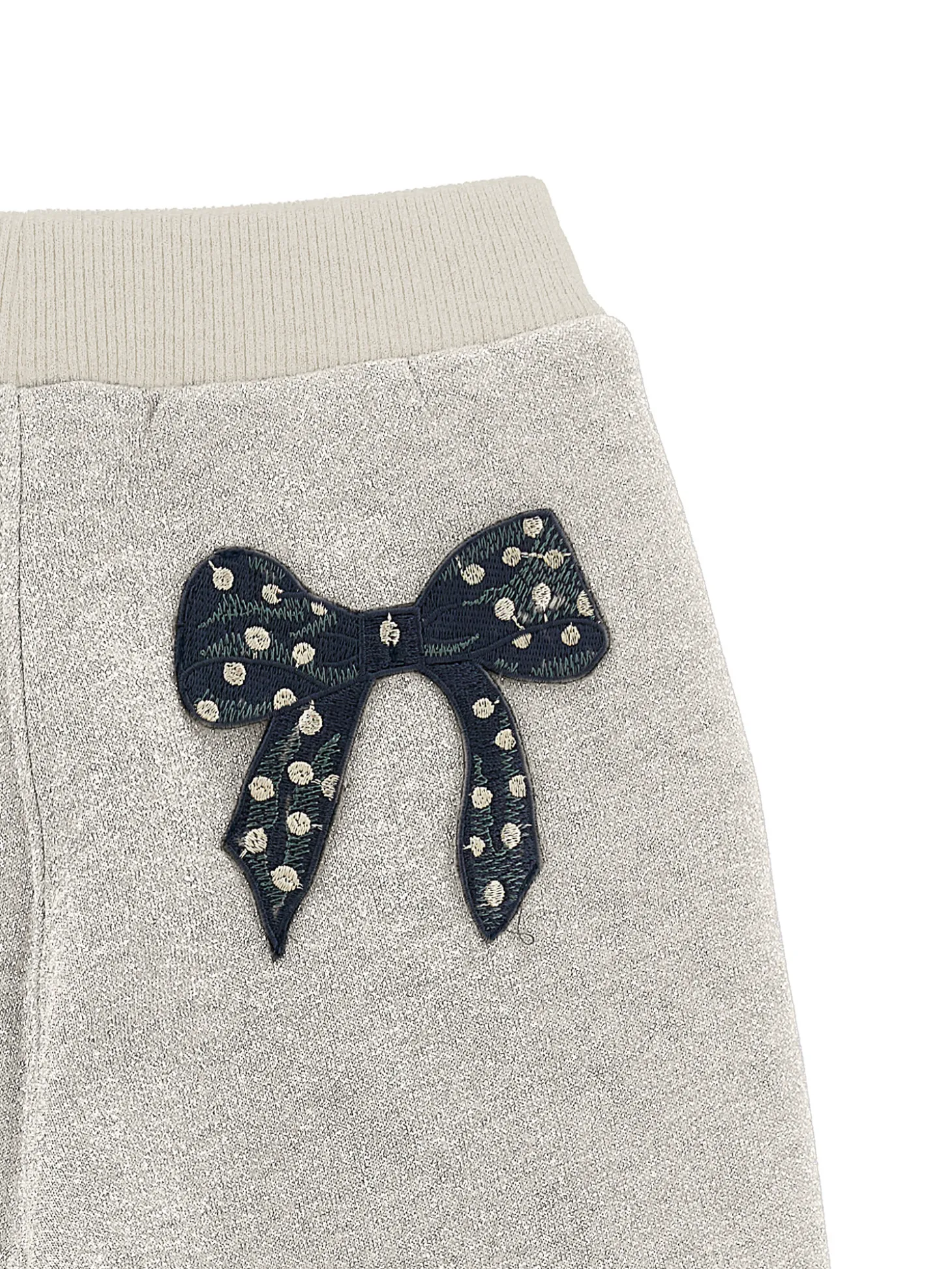 Jogger felpa glitter con fiocco