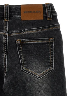 Pantaloni denim con effetto usura